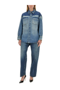 A denim shirt with faded blue wash and darker shoulder patches paired with victoria beckham women’s boyfriend jeans blue