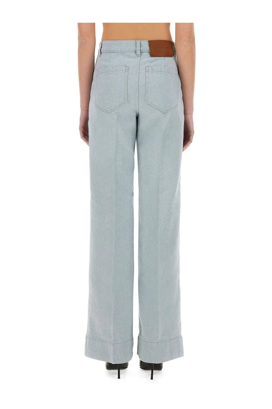 Light blue denim wide-leg trousers with brown leather belt loop from victoria beckham women’s jeans alina blue collection