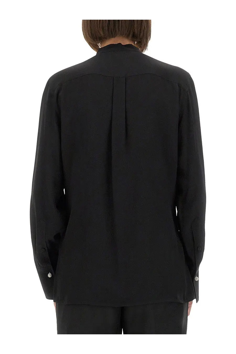 Black silk long-sleeved blouse by Victoria Beckham with high collar and subtle pleats on the back shown from rear view