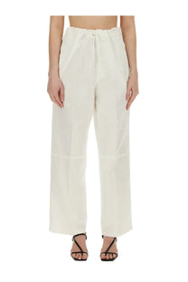 Cream-colored victoria beckham women’s high-waisted wide-leg trousers with a drawstring waistband
