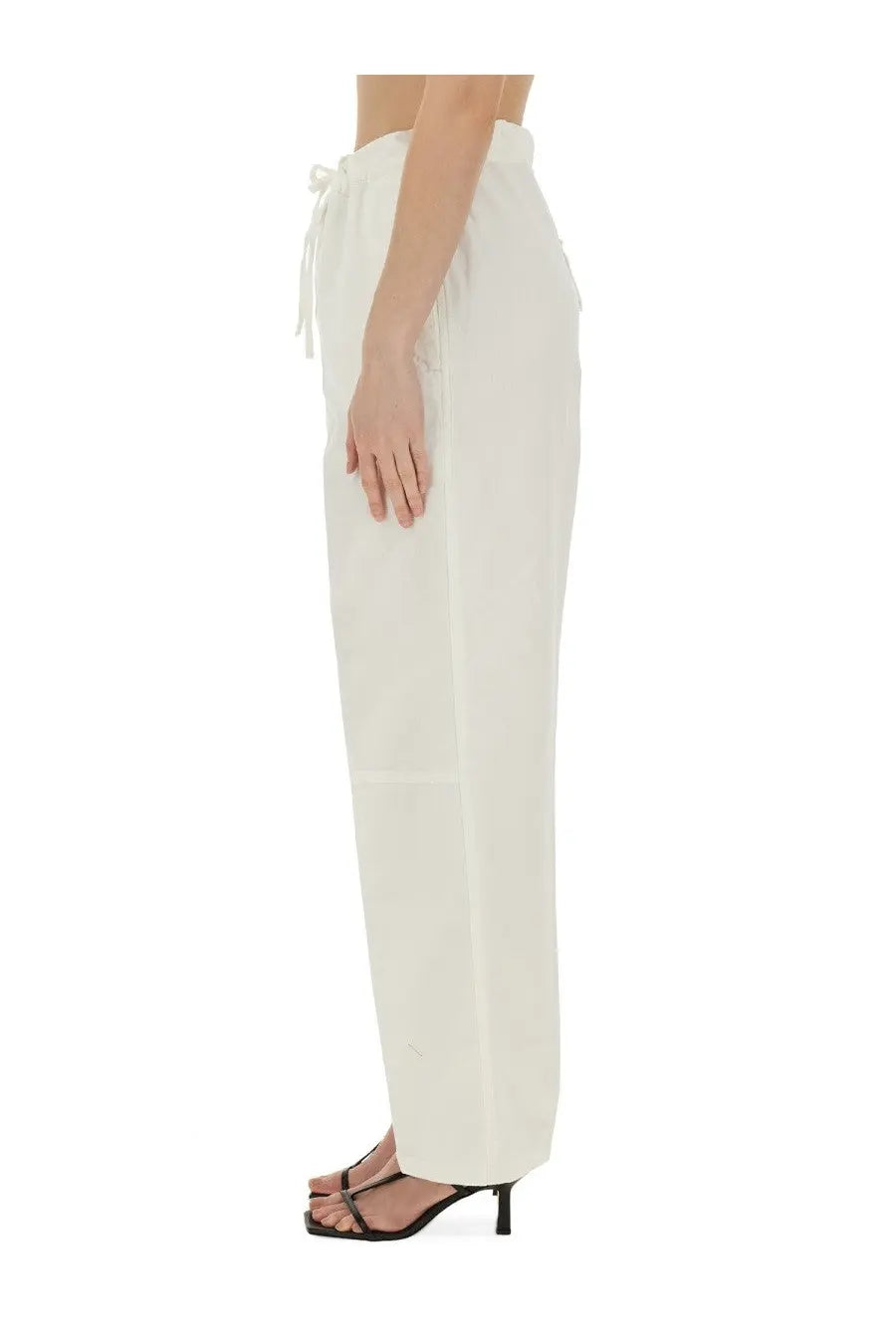 Cream-colored victoria beckham women’s wide-leg trousers with drawstring waist and subtle side pockets