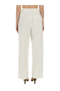 Victoria Beckham women’s wide leg cream trousers in high waist with single patch pocket on back side