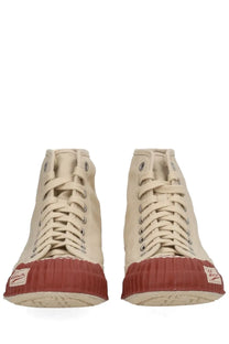 Beige visvim men’s skagway hi sneaker with high-top canvas and textured red rubber toe cap and matching label