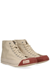 Beige Visvim men’s Skagway HI sneaker with rust rubber toe cap and stitched detailing in high-top canvas design