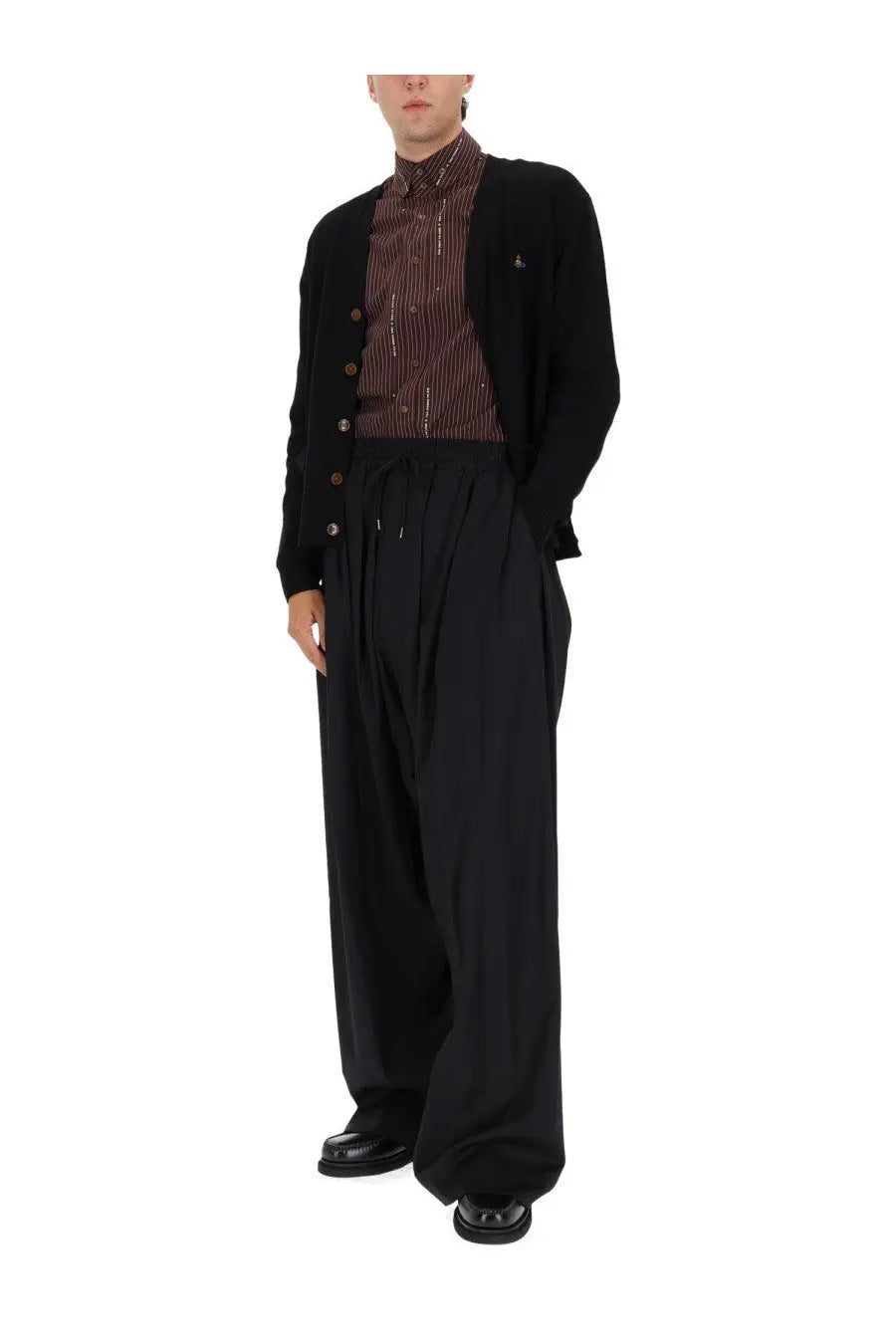 Vivienne westwood men’s cardigan alex black paired with black wide-leg trousers with a drawstring waist