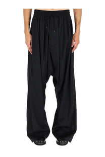 Vivienne Westwood men’s black drawstring harem pants with loose flowing silhouette and tapered legs
