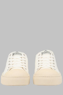 Vivienne Westwood men’s low top Primsoll white canvas sneakers with cream rubber soles and logo on the tongue