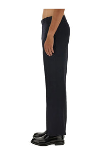 Black wool tailored trousers by Vivienne Westwood men’s with sleek straight-leg cut and subtle fabric creasing