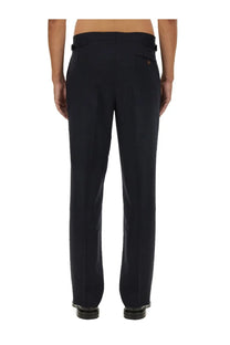 Vivienne westwood men’s wool pants blue shown from the back with black tailored straight-leg trousers and subtle pleats