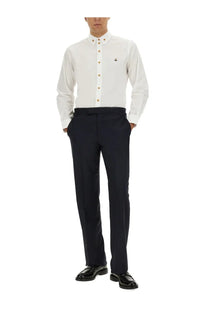 White button-down shirt with gold-tone buttons and embroidered logo paired with vivienne westwood blue wool pants