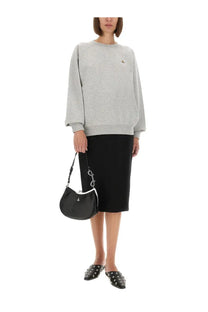 Black leather handbag with silver chain strap and metallic clasp paired with vivienne westwood unisex grey sweatshirt