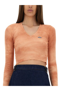 Vivienne Westwood women’s peach-colored ribbed long-sleeve v-neck crop top with small embroidered logo on chest