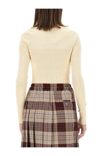Vivienne Westwood women’s Bea shirt white cream ribbed knit long-sleeve top paired with a plaid skirt