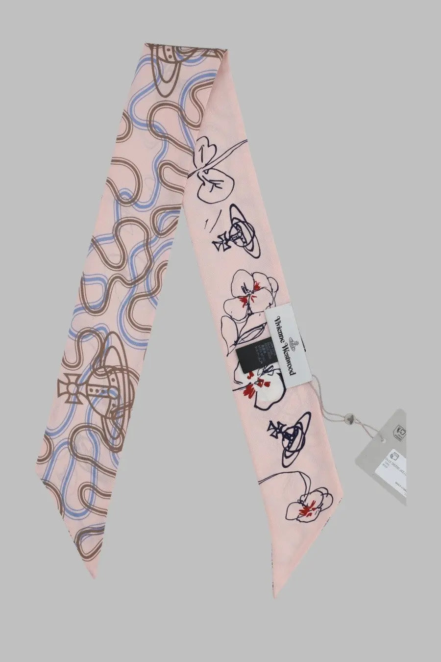 A delicate pink vivienne westwood silk beandeau scarf with whimsical black brown and blue flower and orb line drawings