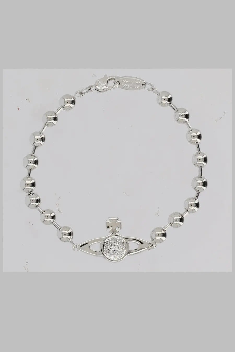 Silver bead bracelet with central vivienne westwood orb charm featuring diamond-studded disc and cross detail