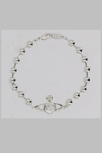 Silver bead bracelet with central vivienne westwood orb charm featuring diamond-studded disc and cross detail