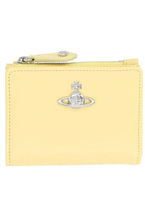 Pale yellow leather zippered wallet with silver orb logo clasp for women by vivienne westwood