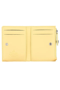 Vivienne Westwood women’s pale yellow card holder with smooth leather finish and silver snap buttons