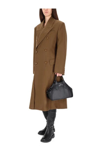 Black leather handbag with distinctive vivienne westwood logo front shown with women’s beige coat winston design