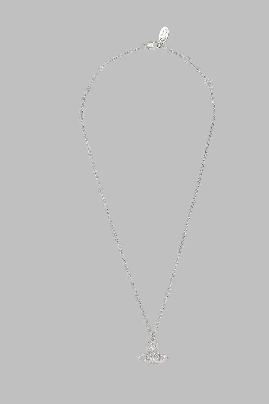 Silver chain necklace with a diamond-encrusted orb pendant and gold vivienne westwood logo tag for women
