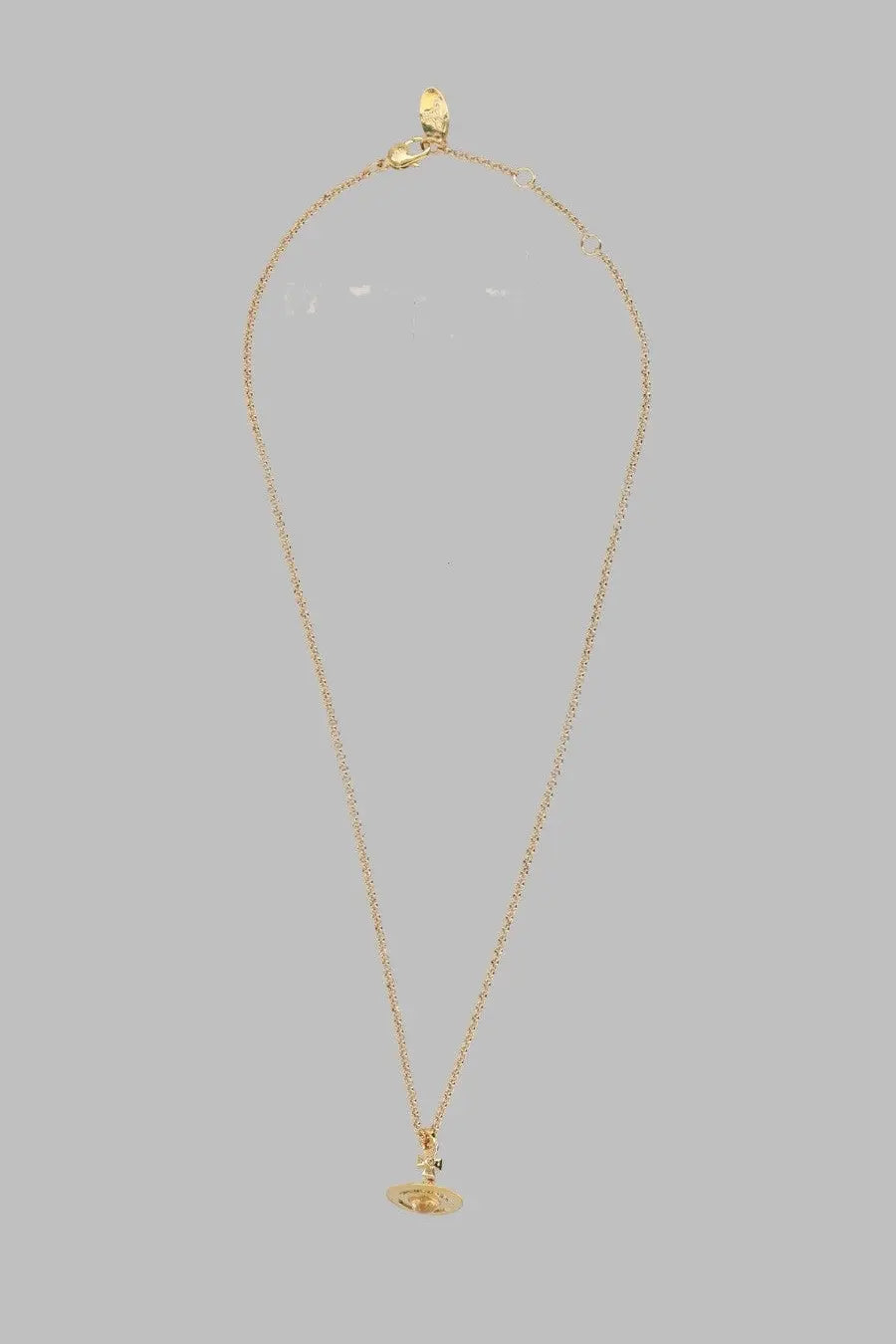 Vivienne Westwood women’s gold chain necklace with small round pendant featuring a central gemstone