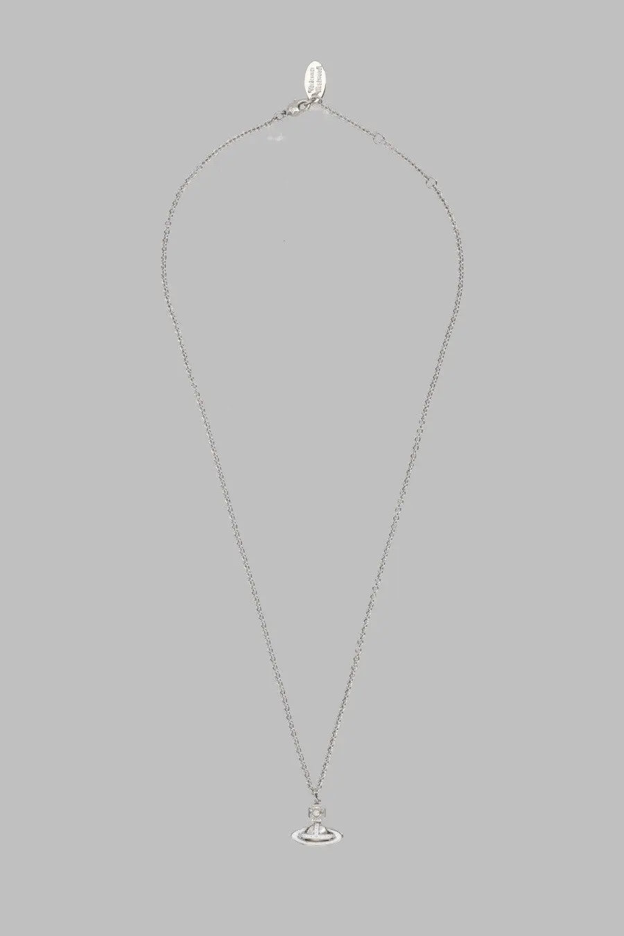 Silver chain necklace by vivienne westwood featuring a small circular pendant with a central gemstone