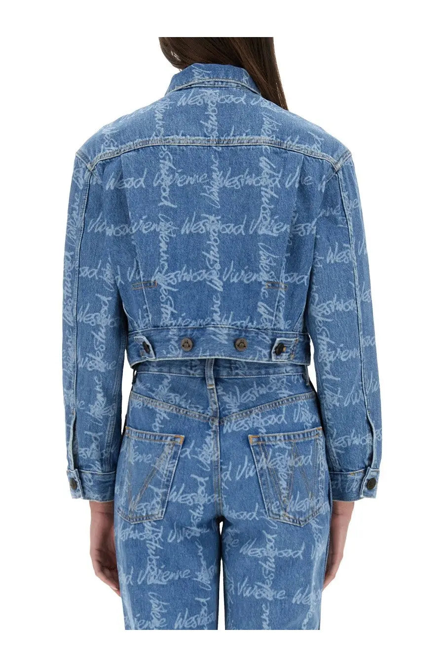 Back of vivienne westwood women’s cropped blue denim jacket with repeating white westwood script print on back and sleeves