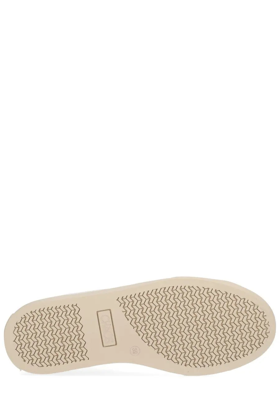 Beige rubber sole with herringbone tread and rectangular brand label on vivienne westwood women’s white low top plimsoll sneaker