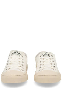 Vivienne Westwood women’s low top plimsoll sneaker white canvas with beige rubber sole and silver eyelets logo tongue