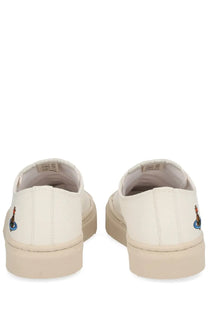 Vivienne westwood women’s low top plimsoll sneaker white canvas slip-on with beige rubber sole and embroidered logo on heel back side