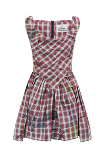 Vivienne Westwood women’s mini dress featuring a sleeveless fitted bodice and flared skirt in red white plaid with black ink splatters