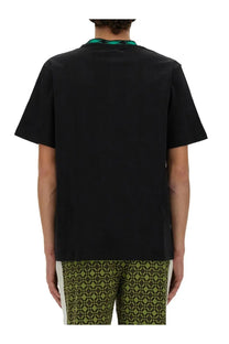 Wales Bonner men’s black cotton t-shirt with short sleeves green patterned collar and geometric hem design