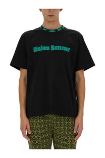 Wales bonner men’s black cotton t-shirt with teal lettering and geometric patterned collar across chest