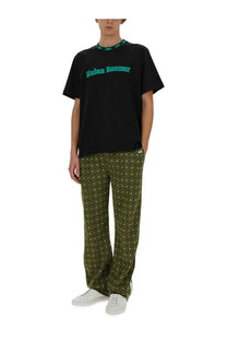 Wales Bonner men’s black cotton short-sleeved t-shirt with teal kales bonner lettering and patterned collar