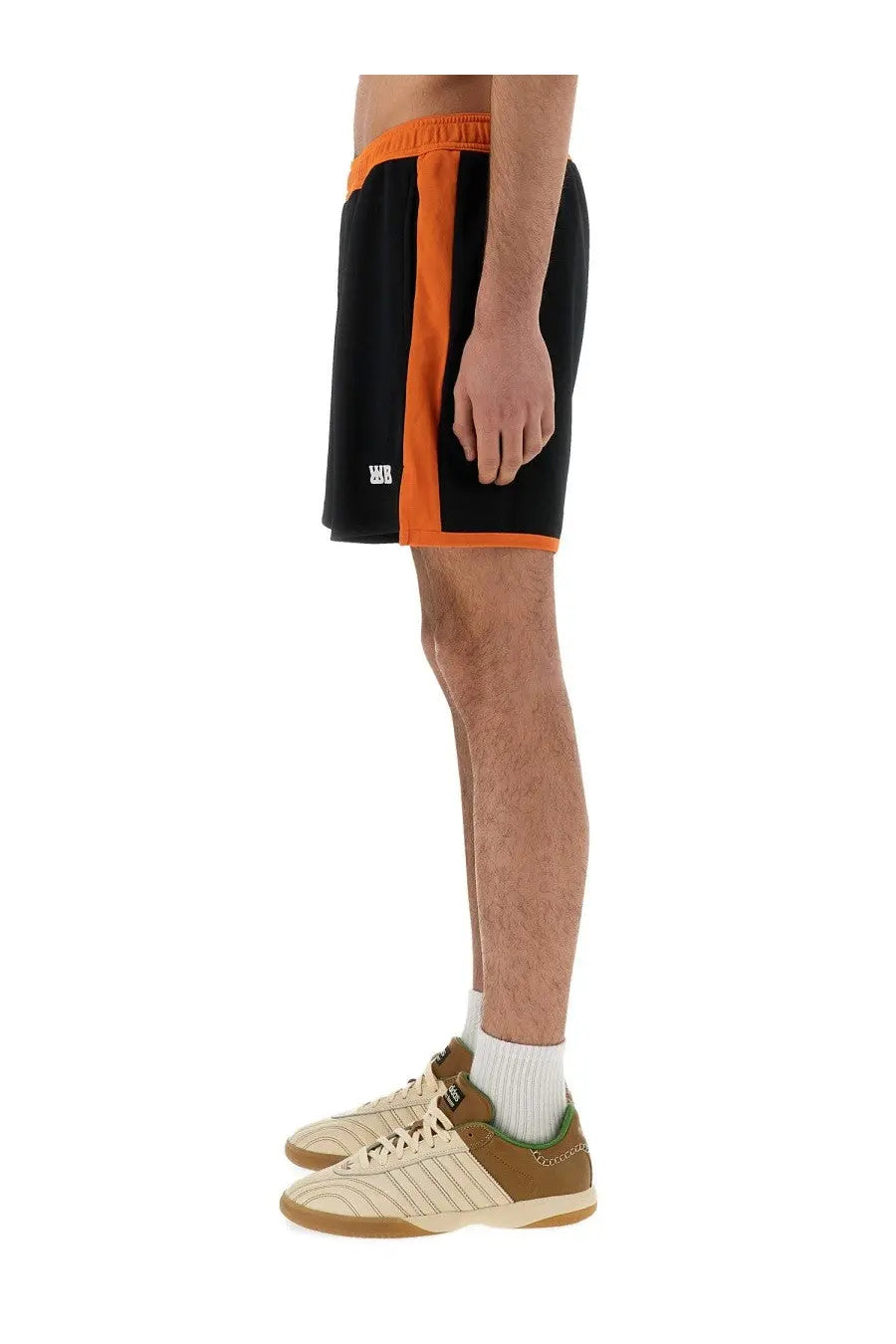 Wales Bonner men’s black jersey shorts with bold orange side stripes elastic waistband and white logo on lower left leg