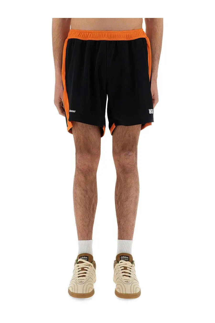 Wales bonner men’s jersey shorts black in black with vibrant orange side panels and waistband featuring sporty design