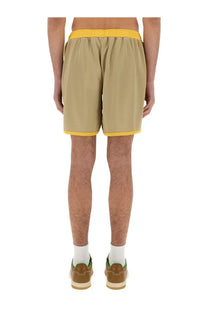 Wales Bonner men’s jersey shorts in beige with bright yellow elastic waistband and matching hem trim