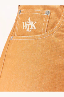 Walk in paris men’s baggy orange denim shorts showing orange pocket with white embroidered wak logo and silver rivets