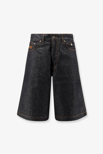 Dark-wash walk in paris men’s baggy raw denim shorts with relaxed wide-leg cut and subtle orange stitching