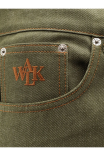 Olive green denim jeans pocket with brown embroidered wak logo and silver rivets on walk in paris gardeners trousers back