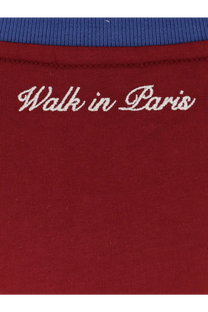 A maroon cotton t-shirt with white embroidered walk in paris script and a contrasting blue ribbed collar