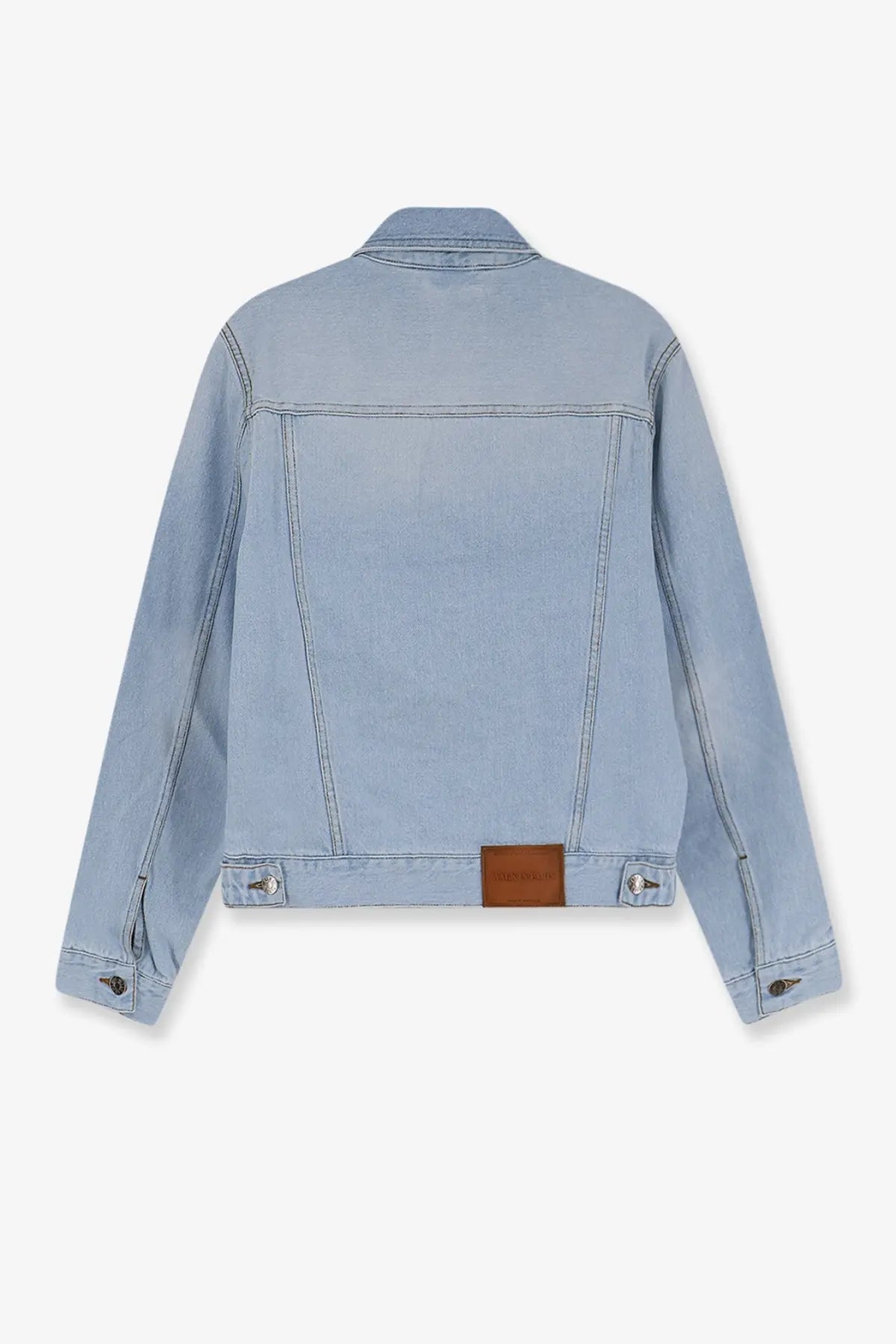 Light blue denim jacket with a brown leather patch at the waistband from walk in paris men’s postman blue collection