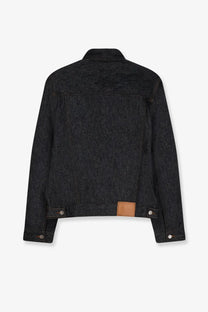 Walk in paris men’s postman dark indigo denim jacket with brown leather patch at waistband shown from the back side