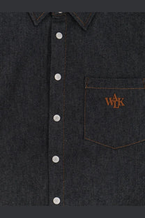 Walk in paris men’s raw denim shirt blue featuring dark denim fabric silver buttons and brown embroidered chest logo