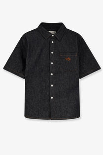 Walk in paris men’s raw denim shirt in dark blue with short sleeves, white buttons, textured weave, and orange logo on pocket