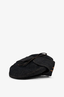 Black denim flat cap with tied leather bow and subtle gold embroidery on the side from walk in paris mens sherlock raw denim hat blue