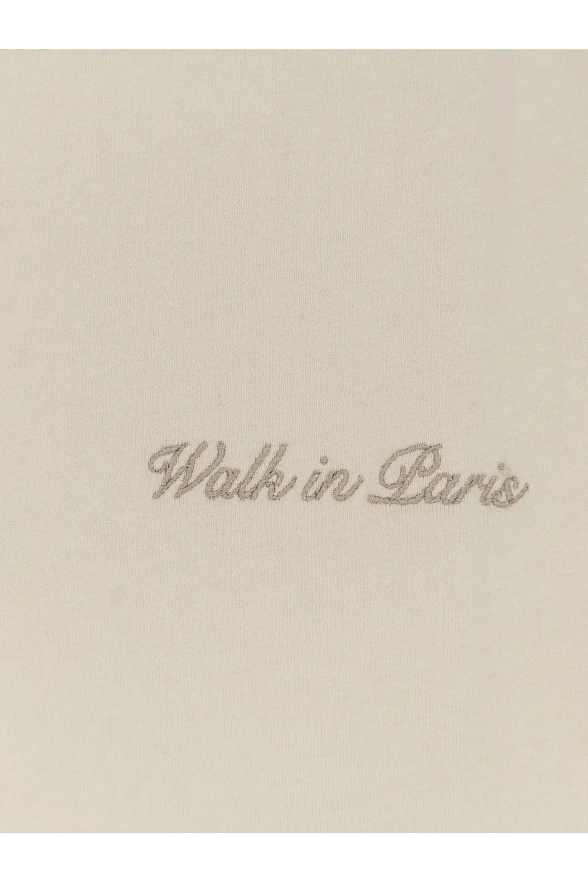 A cream-colored cotton shirt with walk in paris embroidered in silver thread on beige Walk In Paris men’s timeless shirt