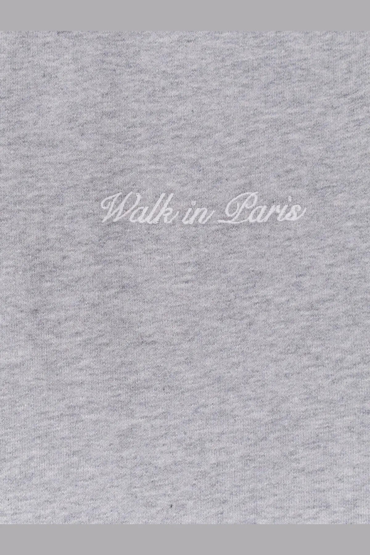 Gray heathered cotton t-shirt with walk in Paris embroidered in white cursive in the Walk In Paris men’s sweatshirt line