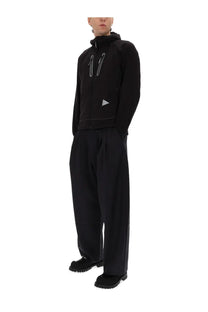 And wander men’s alpha air black hooded jacket with silver zipper and triangular logo on the chest