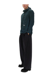 And wander men’s alpha direct dark teal hooded jacket with subtle triangular logo on chest for outdoor use